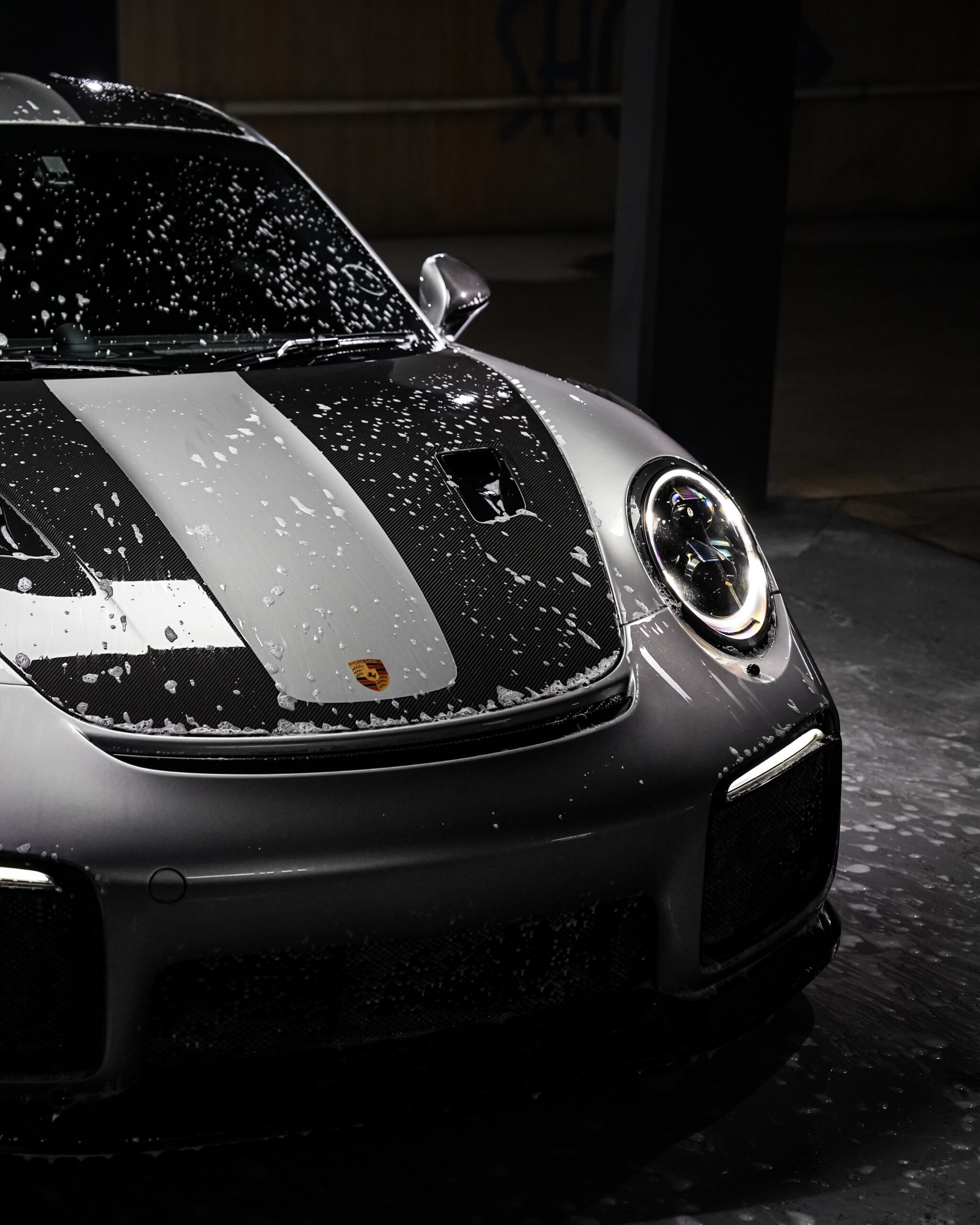 Decontamination product beading across the paint of a Porsche GT2 RS